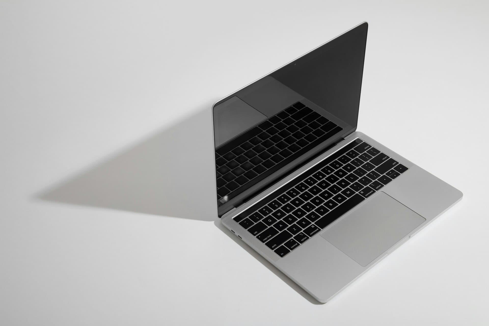 An ex-UK business laptop on a plain background